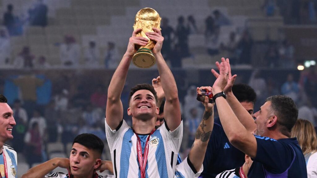 Julian Alvarez Lifting the World Cup trophy