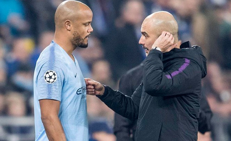 Pep Guardiola with Vincent Kompany